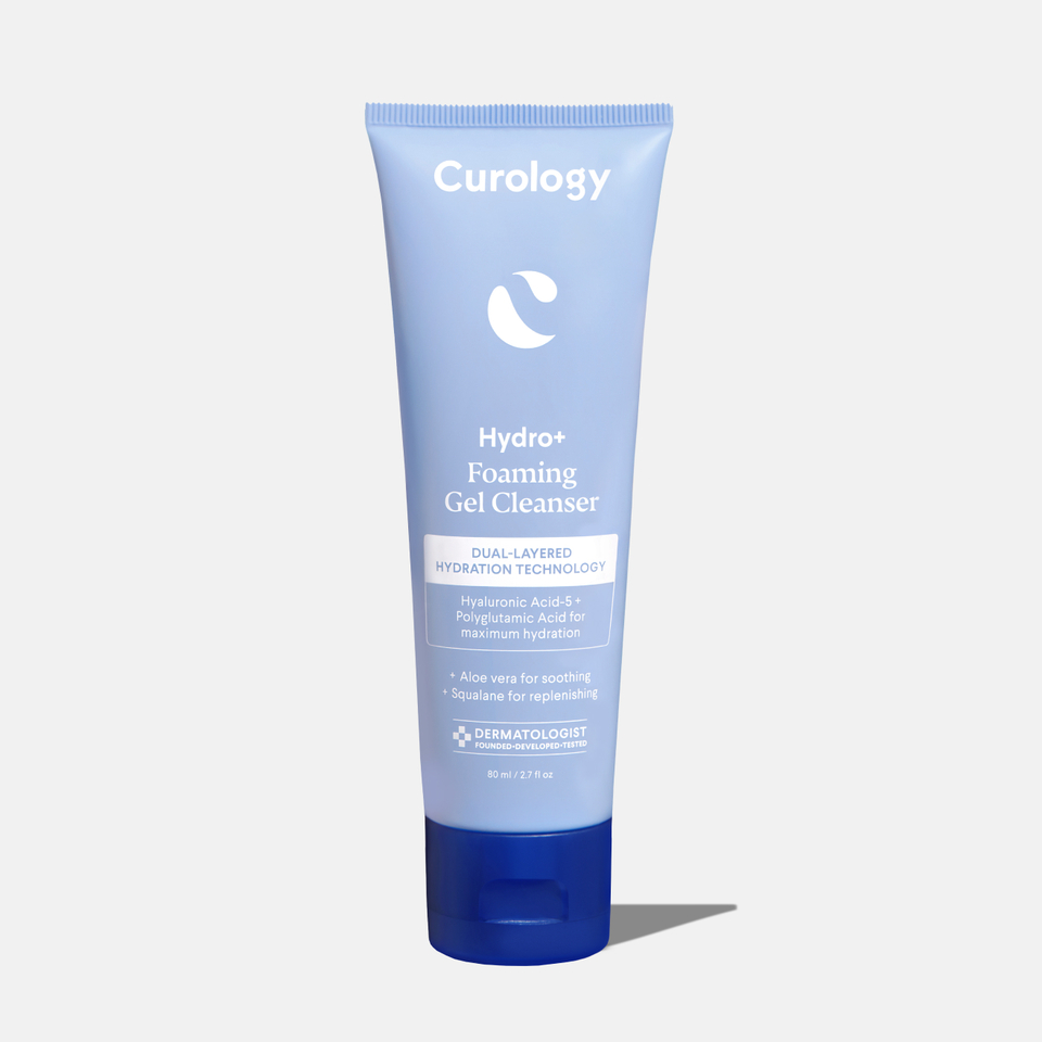 Curology Hydro+ Foaming Gel Cleanser in a light blue squeeze tube with dark blue cap, featuring dual-layered hydration technology for gentle cleansing.